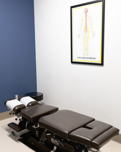 harmony chiropractic treatment room with chiropractic table and other equipment